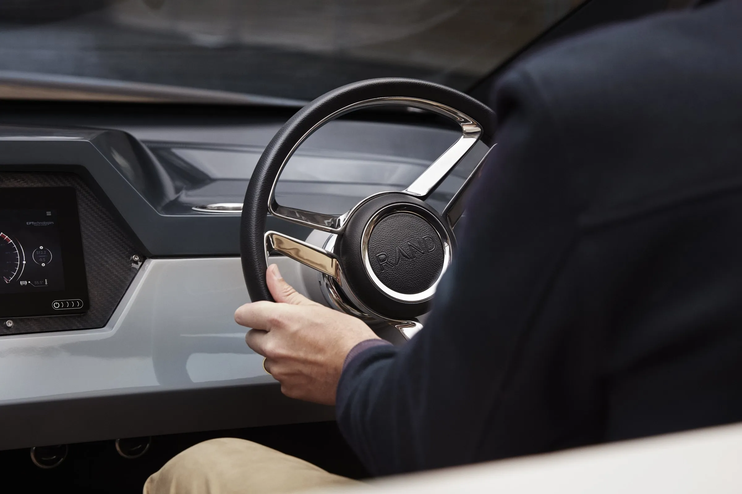 Hands on the wheel of an electric RAND