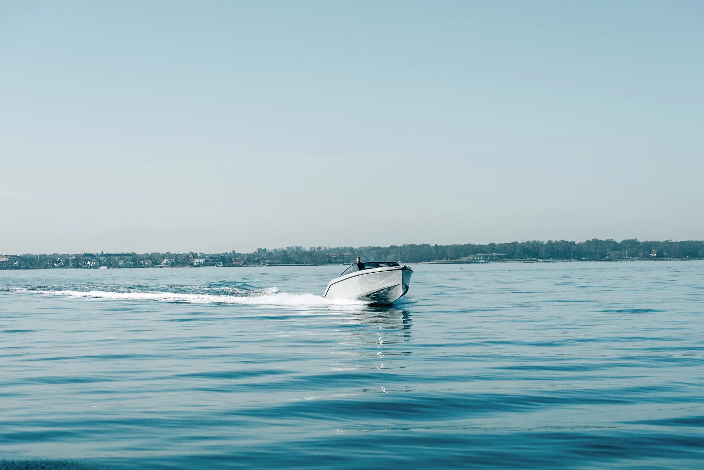 A RAND on glassy morning water off Copenhagen
