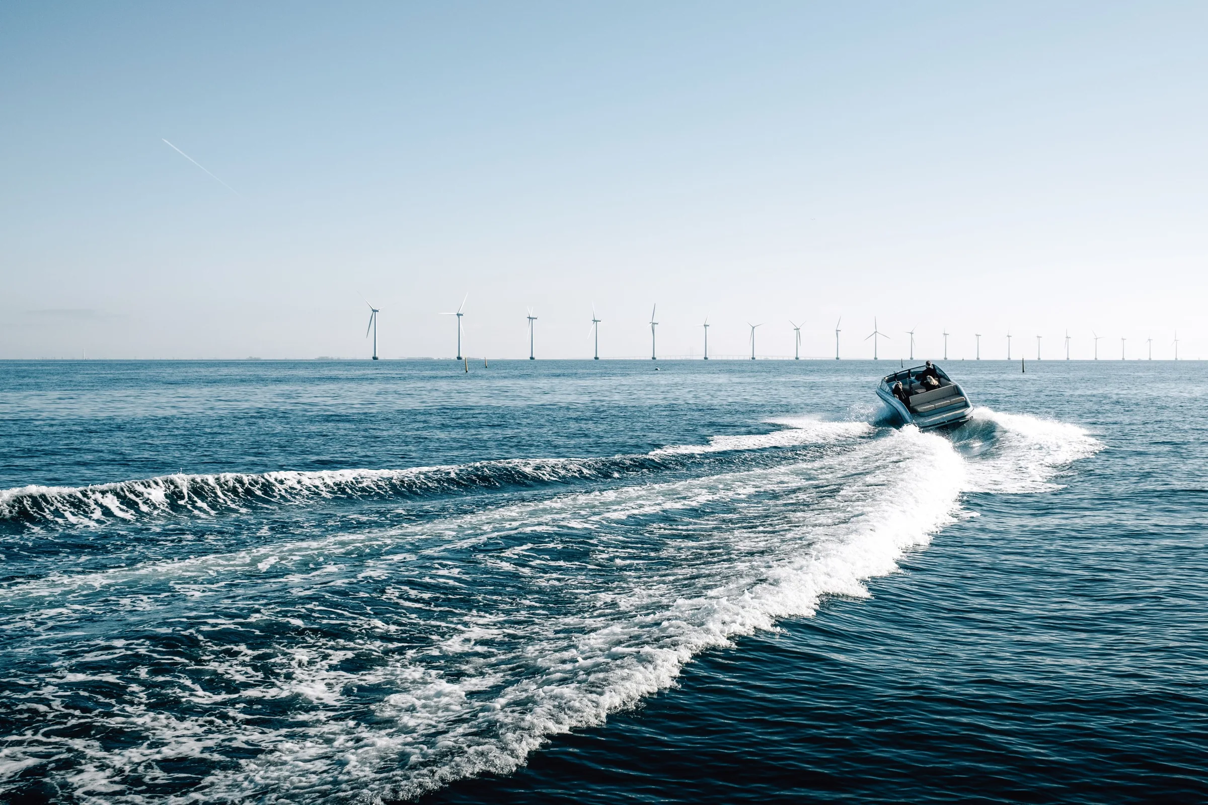 A RAND carving a long wake past the wind farm