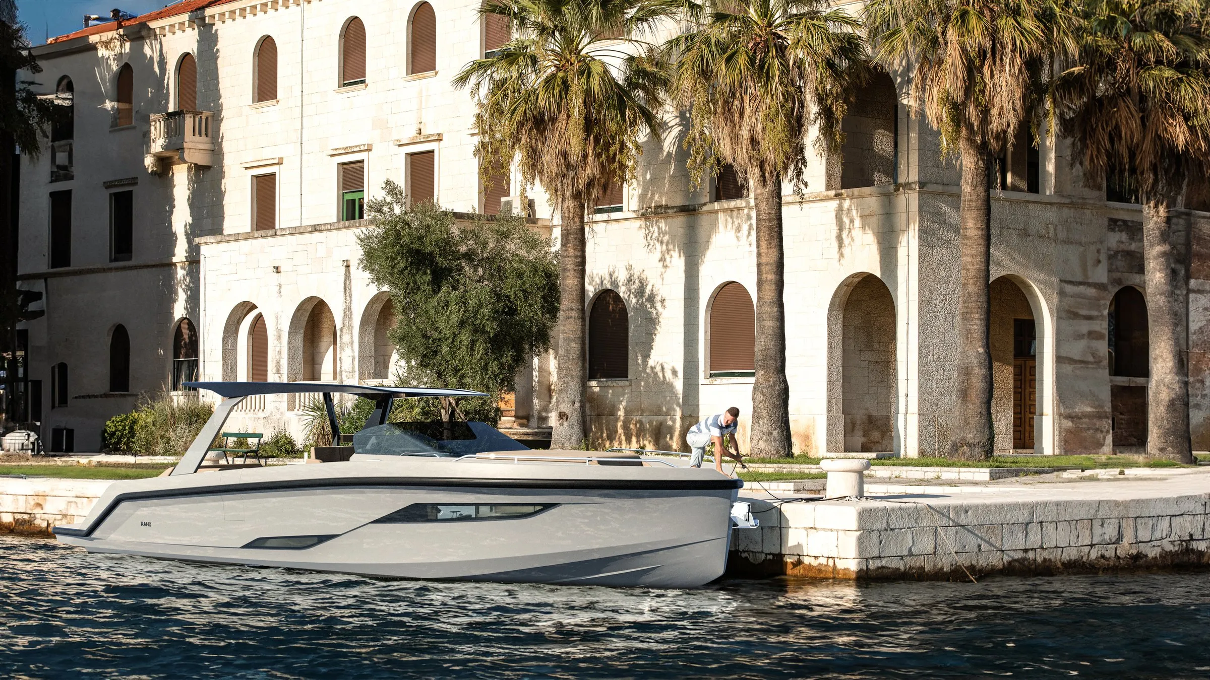 Escape 44 moored in front of a Mediterranean villa